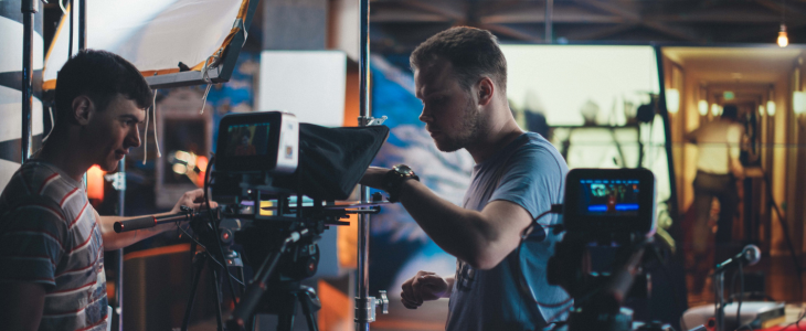 Production crew on set fixing cameras before shooting